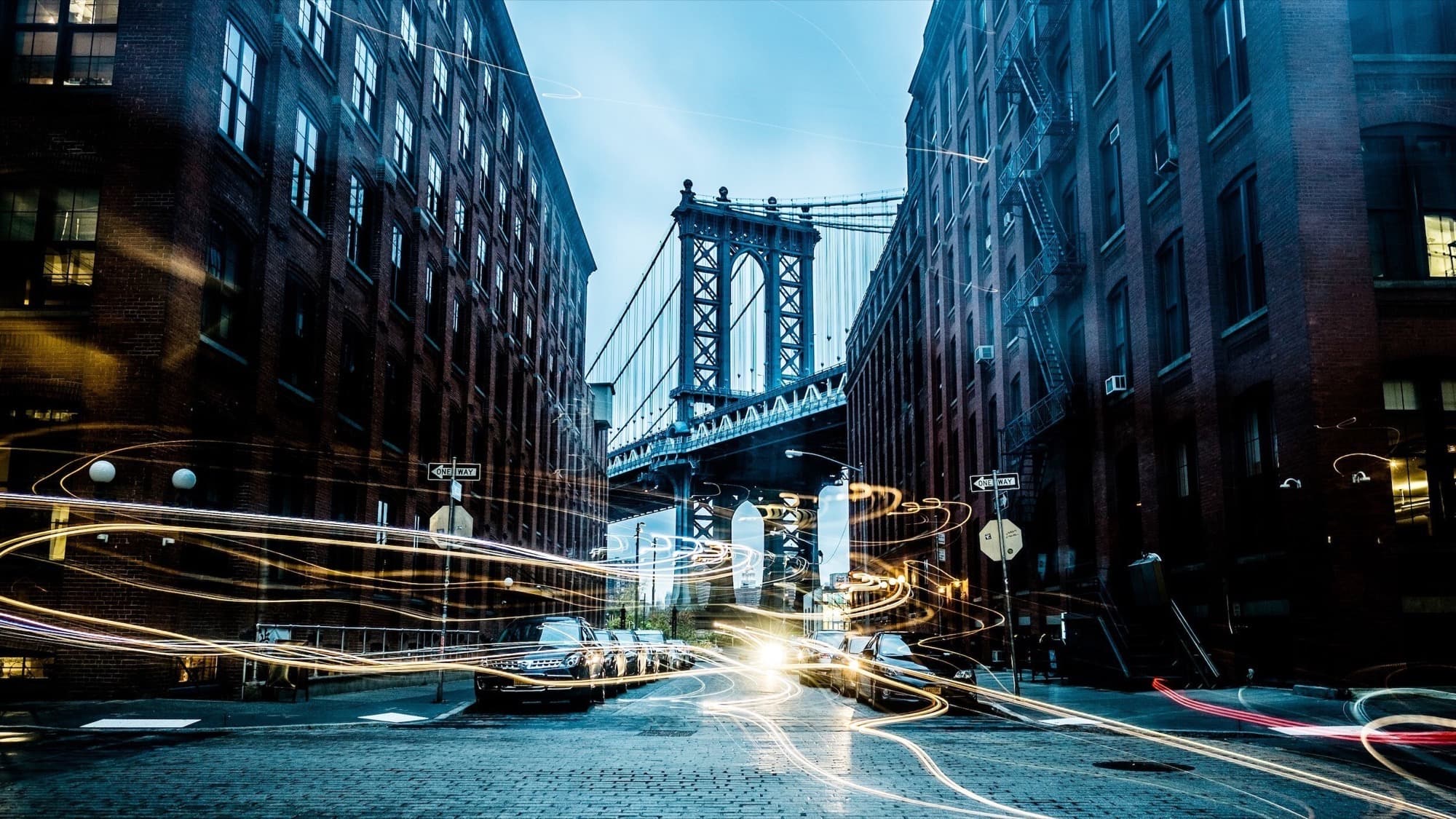 Lower Manhattan seen from the streets of DUMBO at dusk.